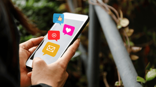 Smartphone with social media icons on screen