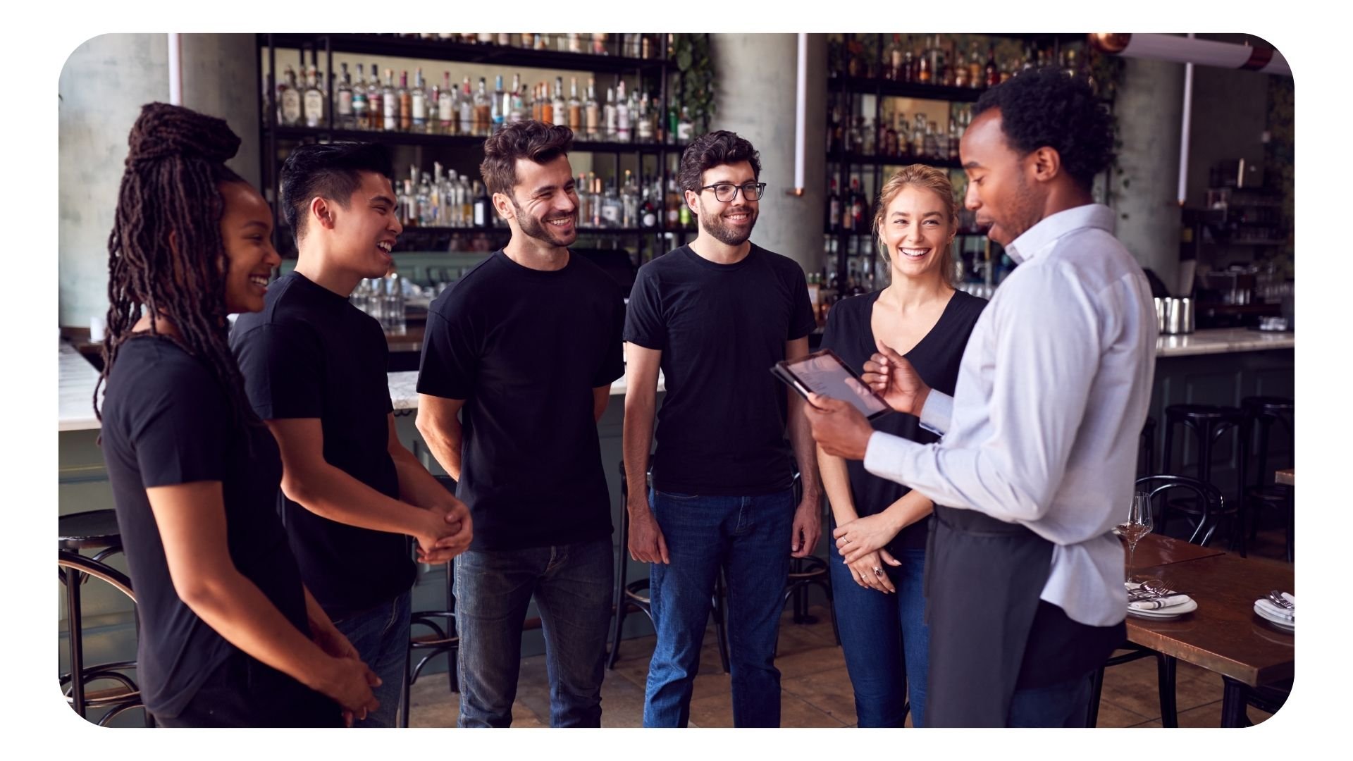 Restaurant manager holding a meeting with his staff