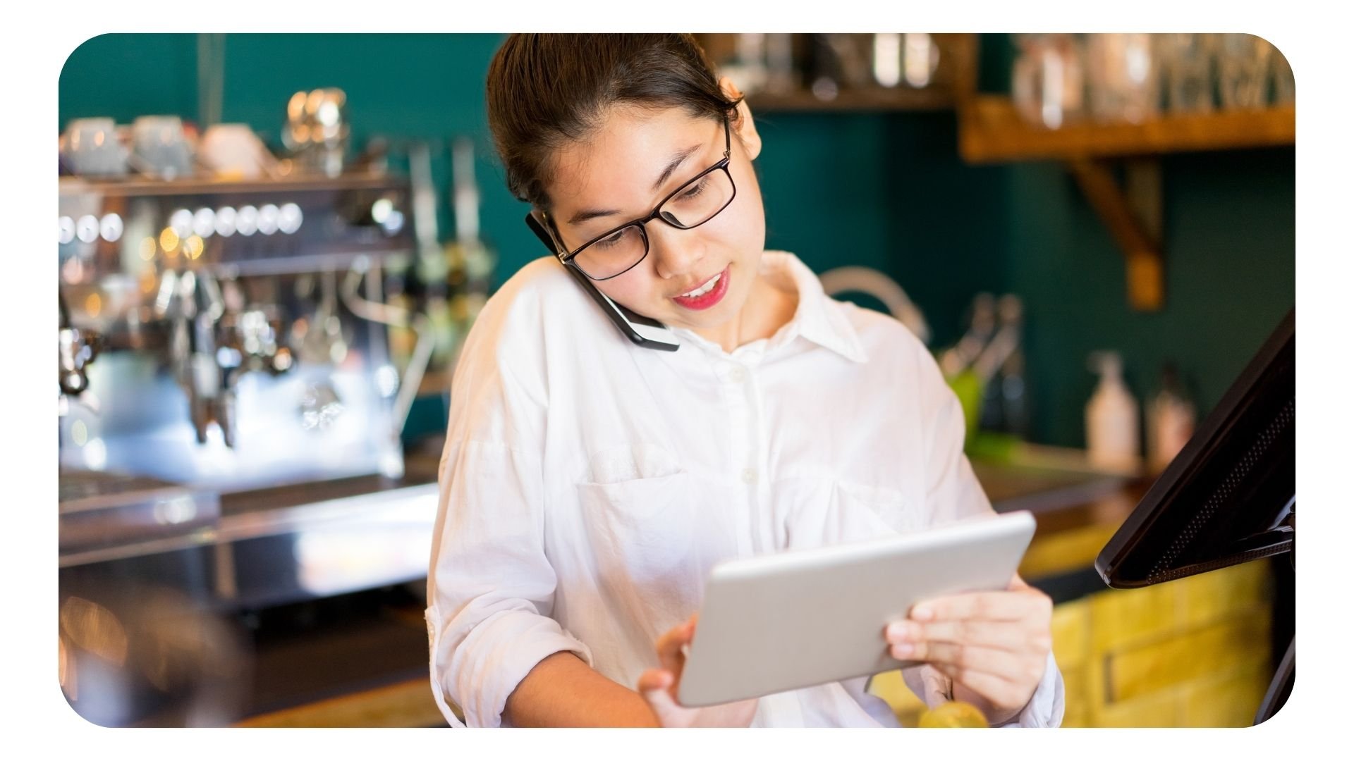 Restaurant manager using tablet device for work