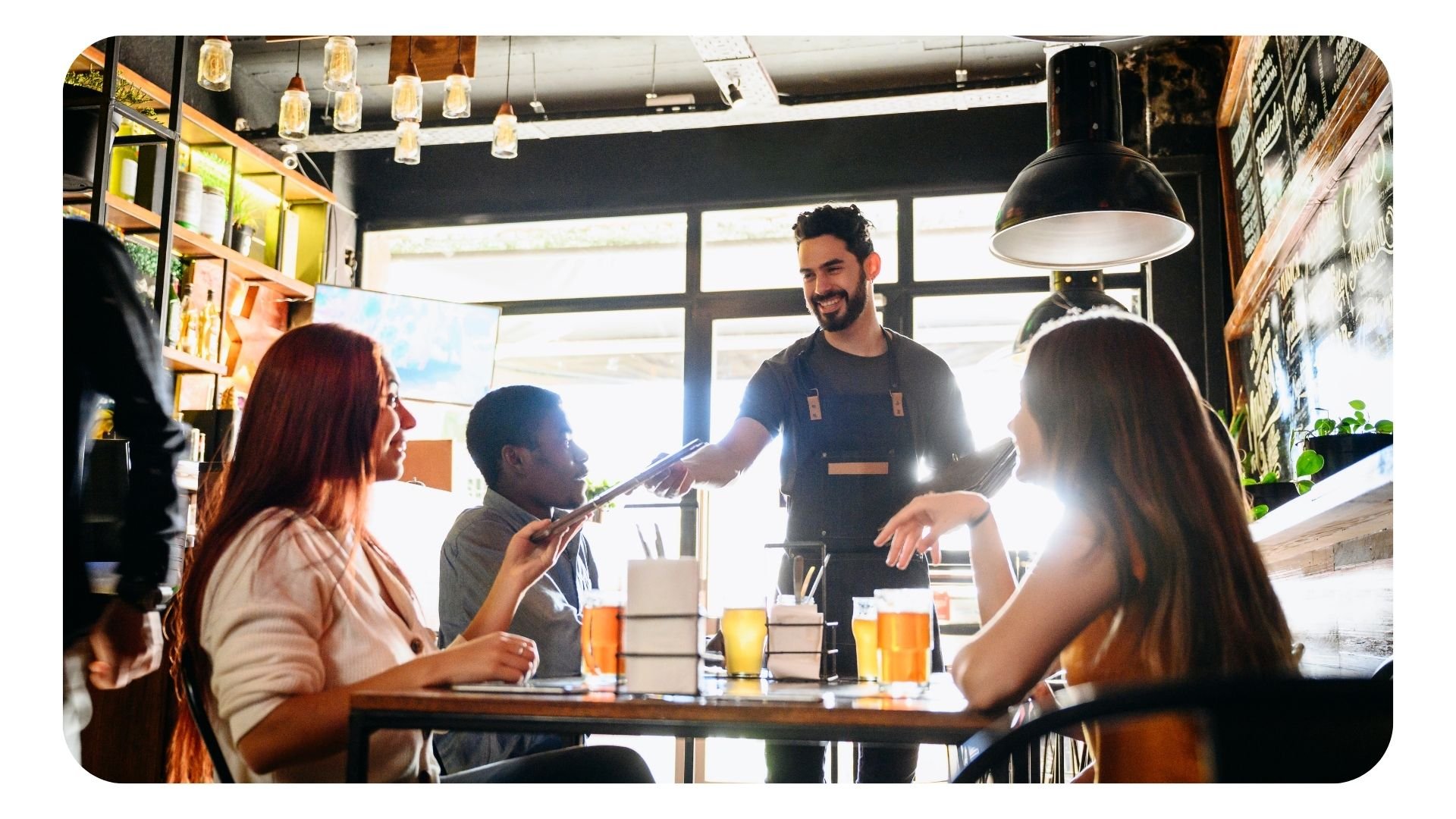 Waiter serving customers in a restaurant