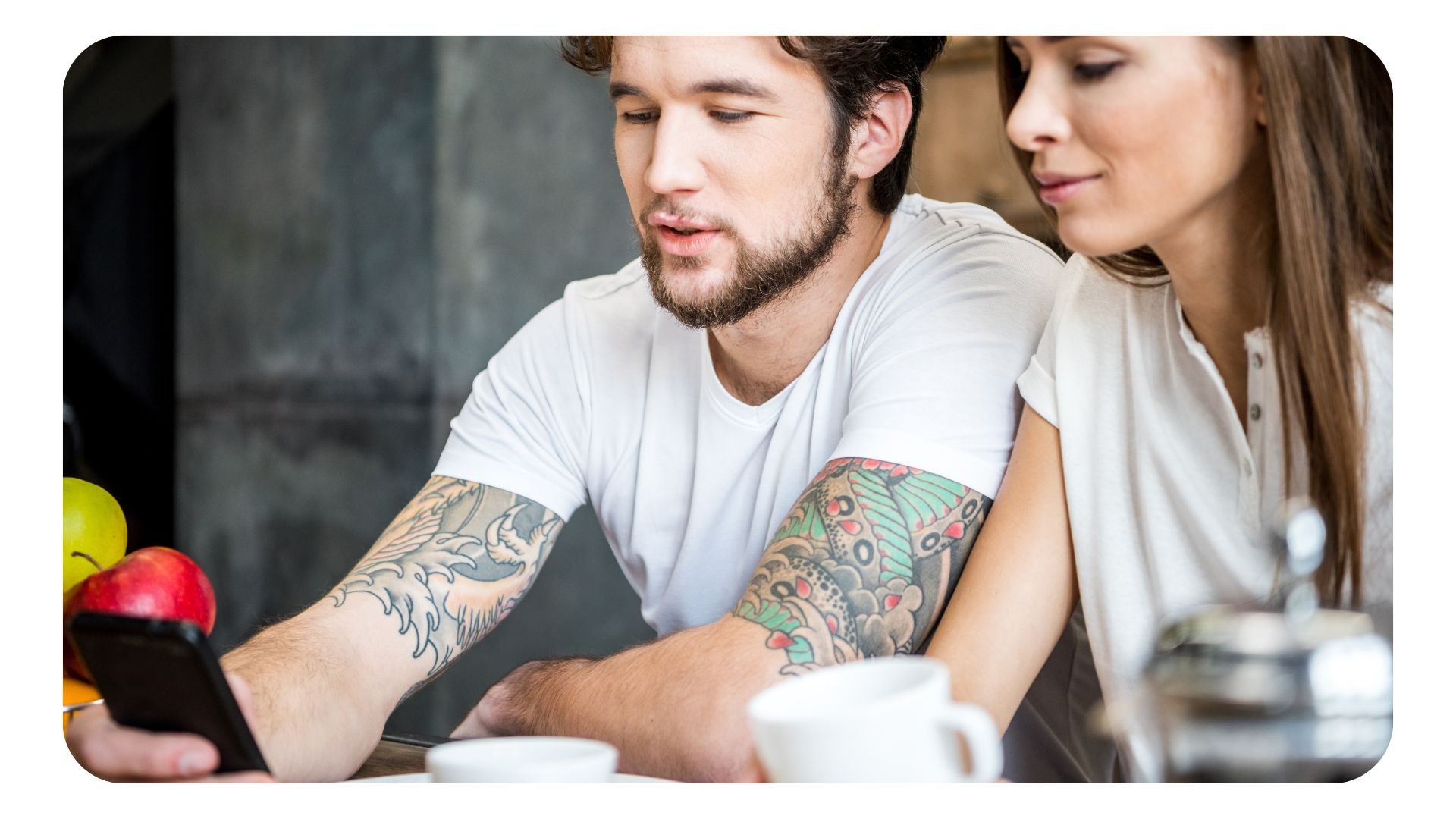 Couple using smartphone to book a restaurant