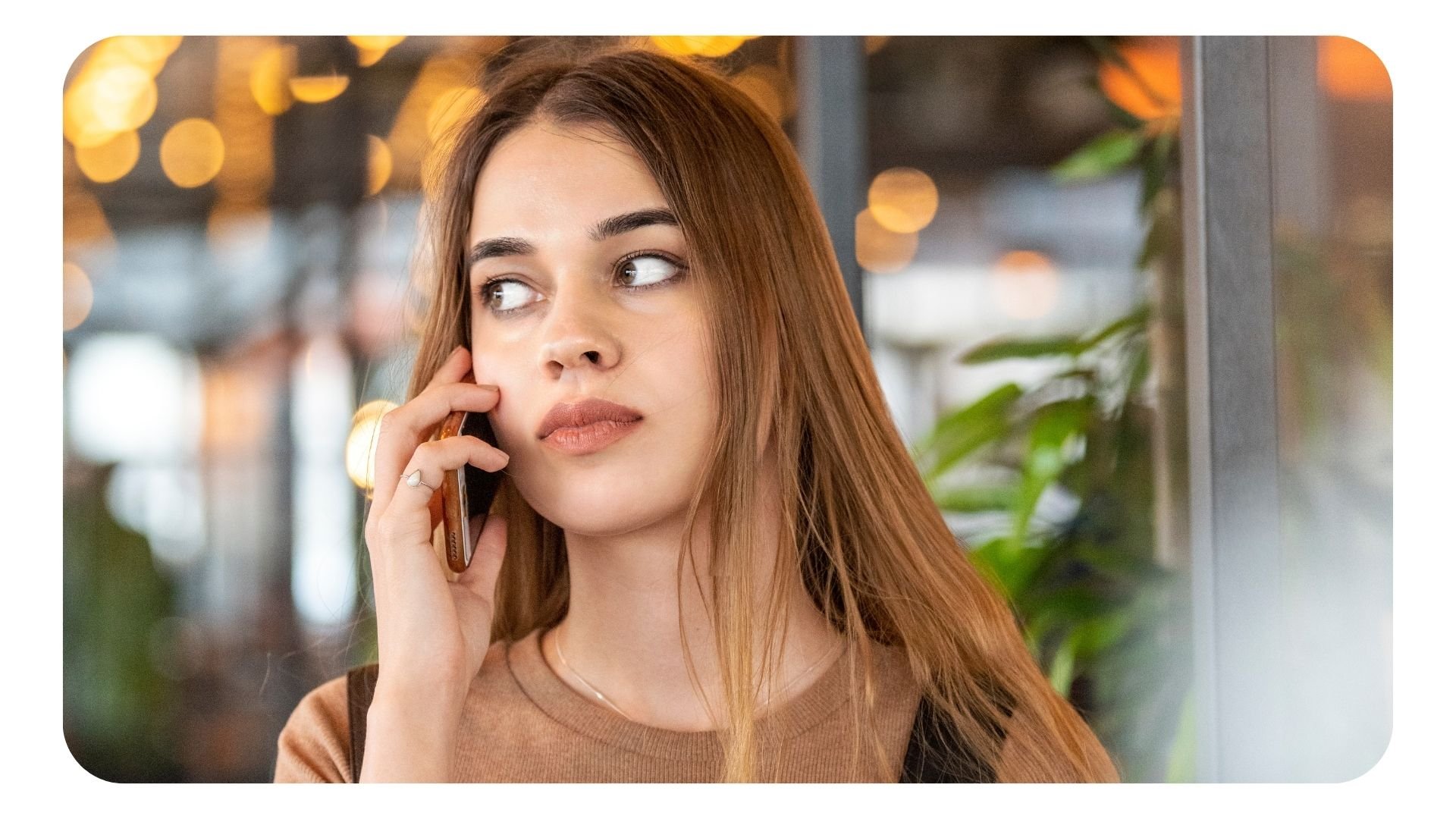 Stressed restaurant worker on phone to customers