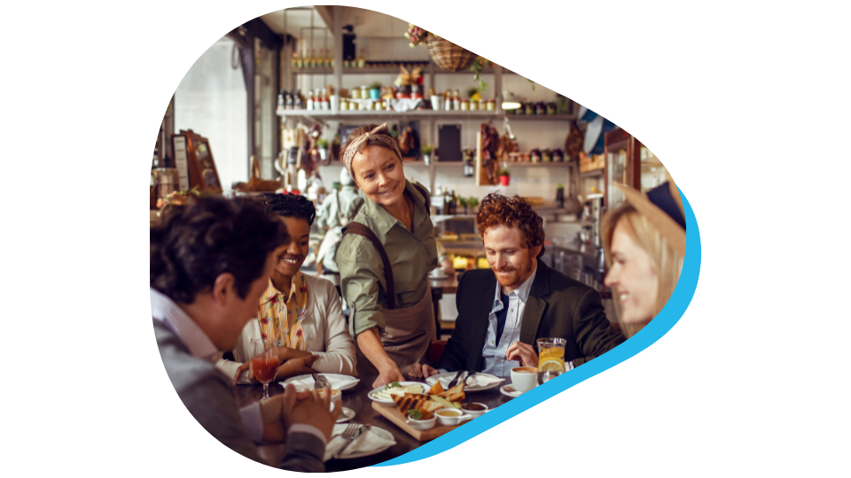 Busy restaurant worker surrounded by diners