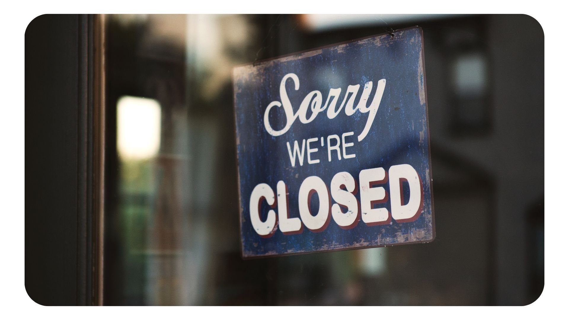 Closed sign in restaurant door