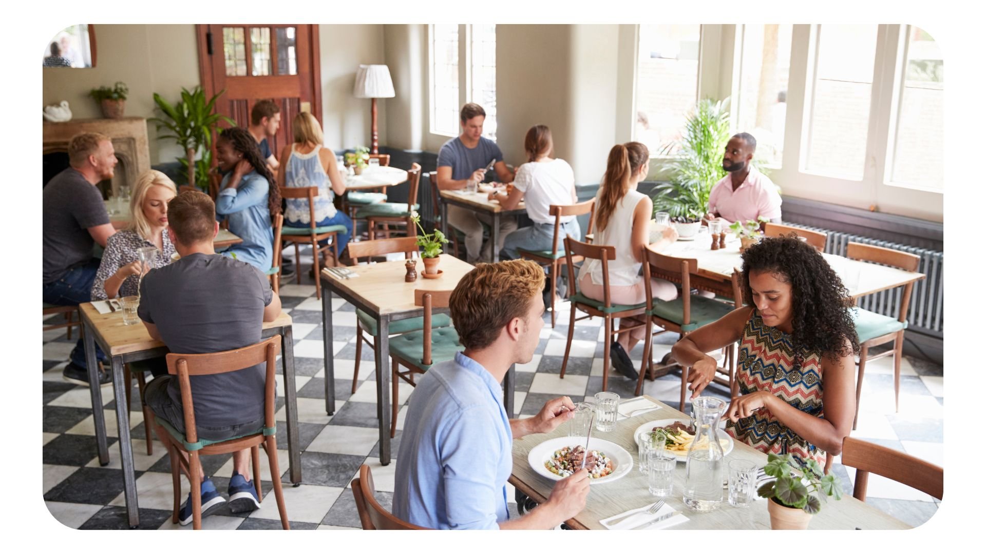 Restaurant filled with customers during the day