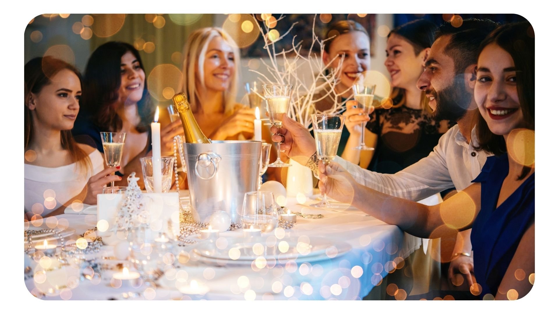 Group of women celebrating festive season with sparkling wine in restaurant