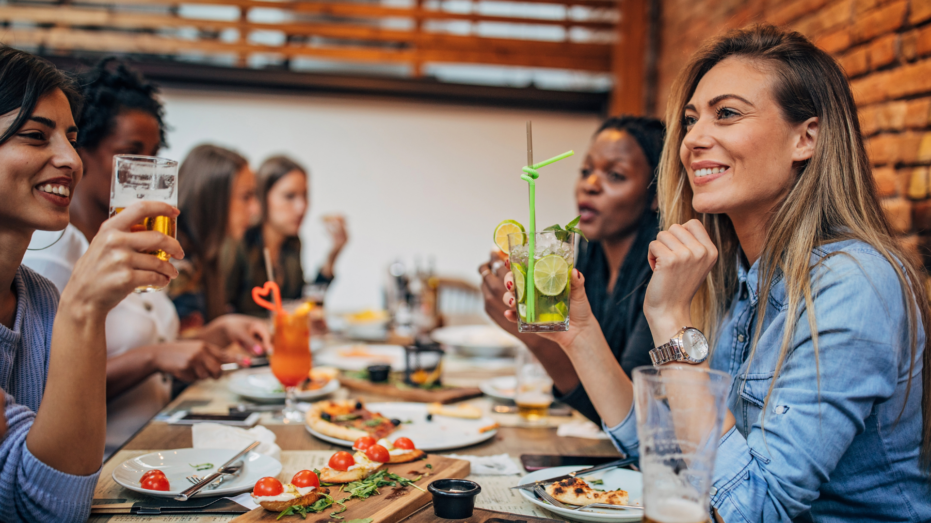Photo of a group of women enjoying a meal in a restaurant