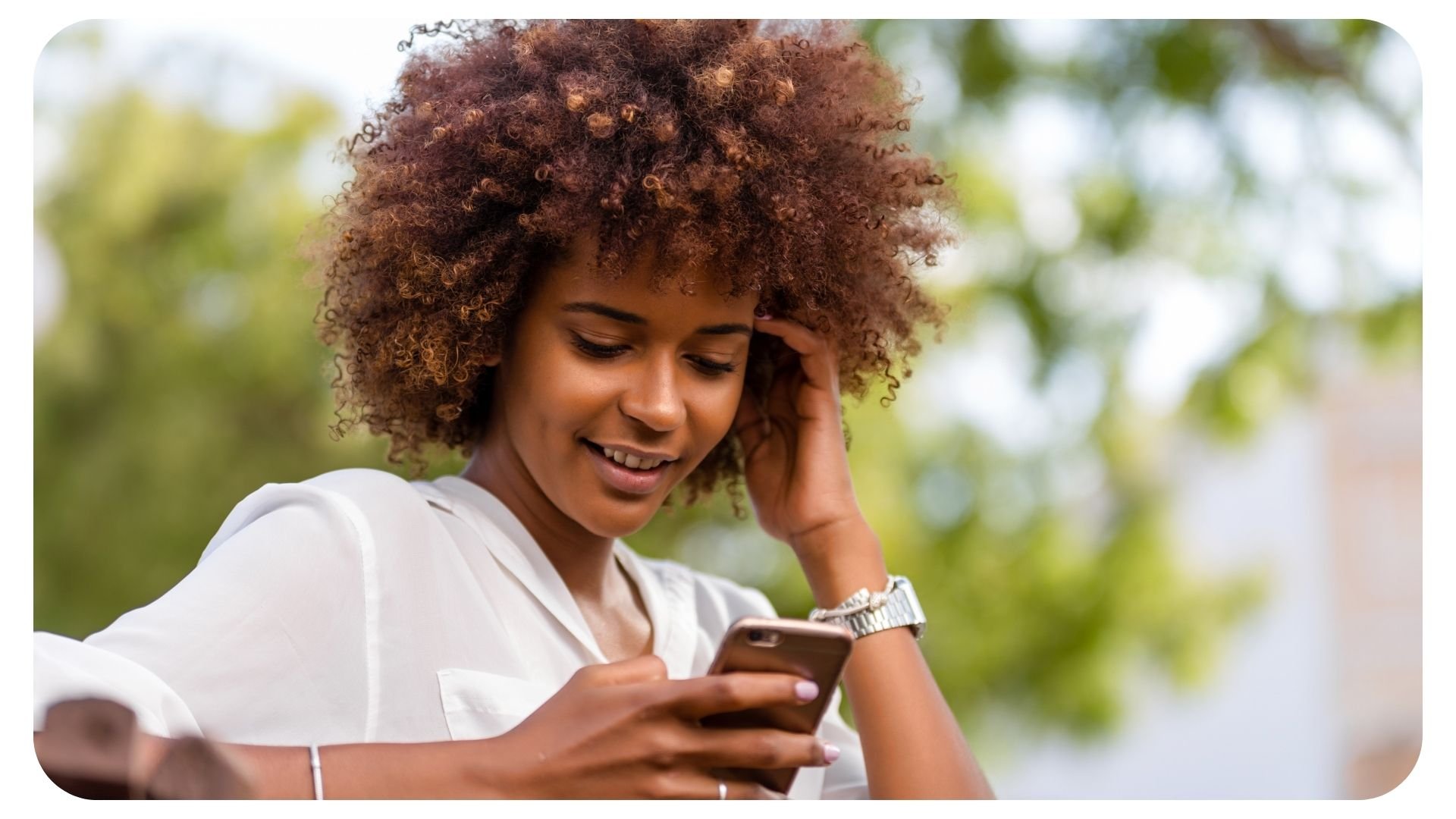 Photo of woman reading a message on her smartphone