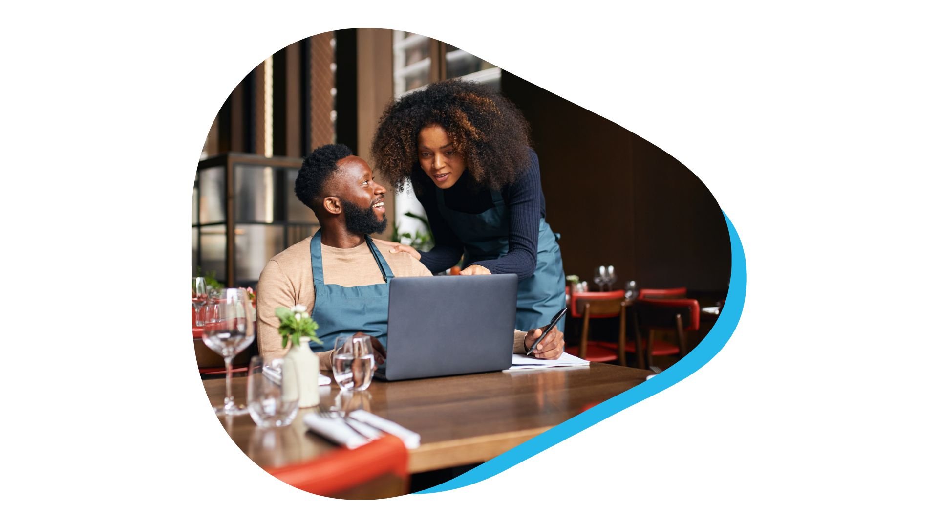 Restaurant staff working on laptop