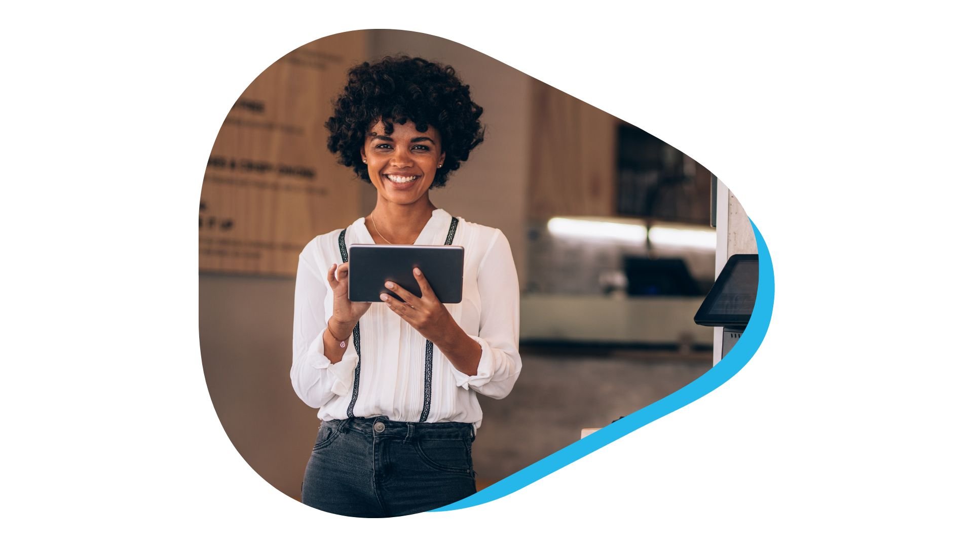 Smiling restaurant worker using tablet device