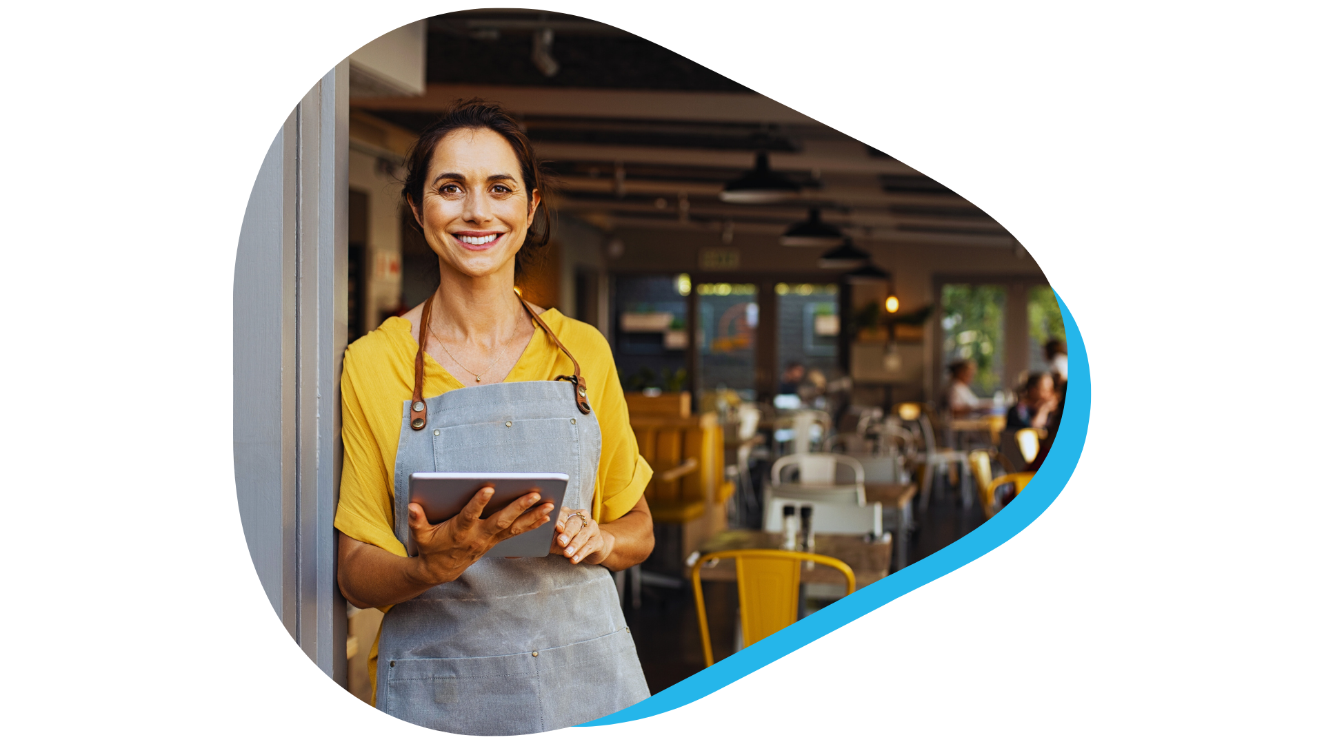 Restaurant manager waiting at entrance with tablet device